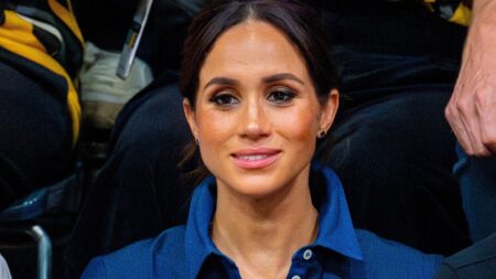 Photo of Meghan Markle in a blue shirt.