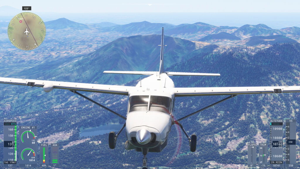 The front of a plane as it sails over a city