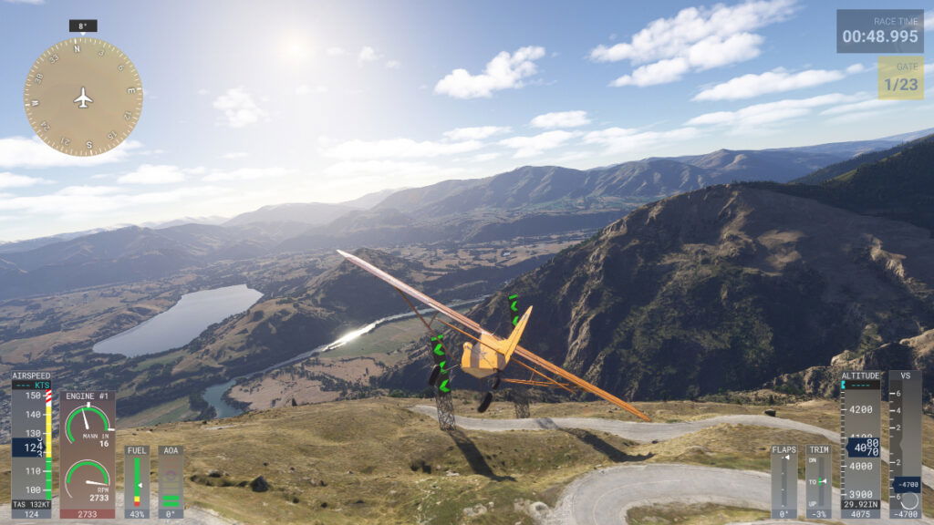 A plane sails through a rally course with a lake in the distance