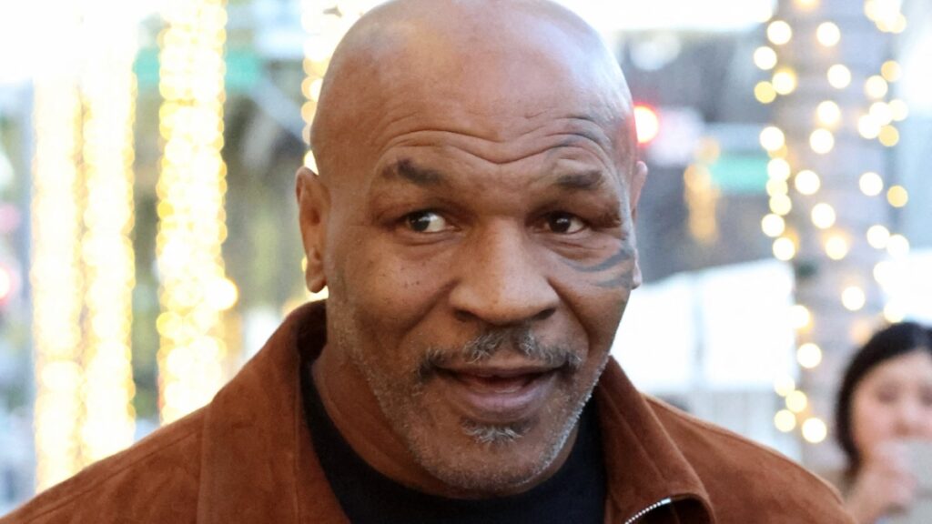 Mike Tyson seen greeting fans on Rodeo Drive after shopping Ferragamo.