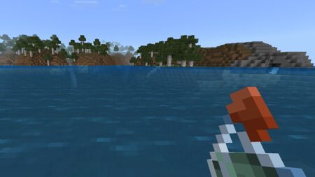 The player looks across the water to distant land while holding a Potion of Water Breathing in Minecraft