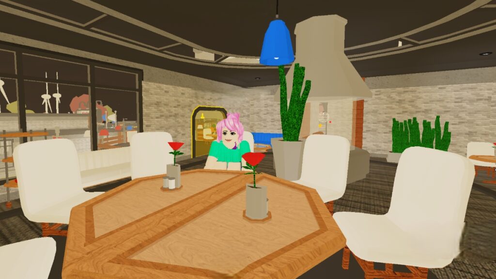 A character sits alone at a table in Roblox Washiez Car Wash