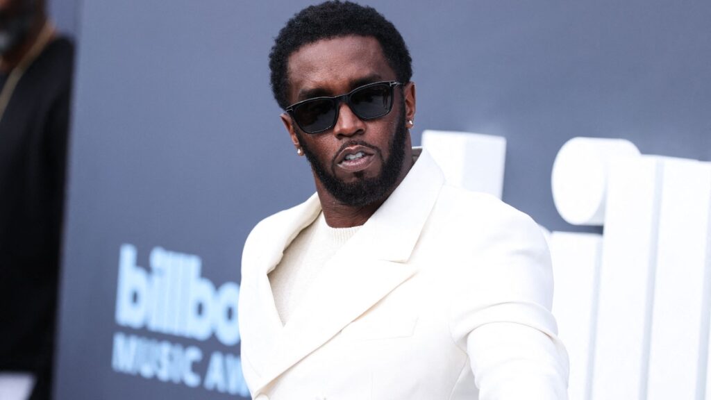 Sean Diddy Combs in a white suit.