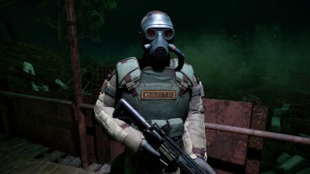 An armored soldier stands under an outdoor light in Stalker 2