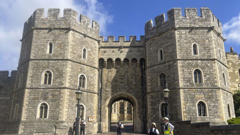 Tourists wait patiently in a half mile long queue for over an hour and half to get into Windsor Castle this morning