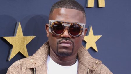 Ray J posing on the red carpet.