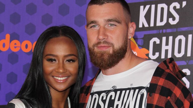 Travis Kelce and Kayla Nicole on a red carpet.