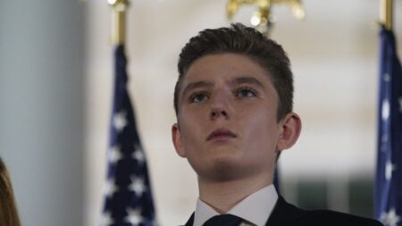 Barron Trump looks on as United States President Donald J. Trump formally accepts the 2020 Republican presidential nomination