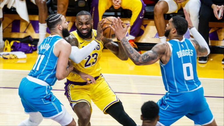 LeBron James drives to the basket against the Charlette Hornets