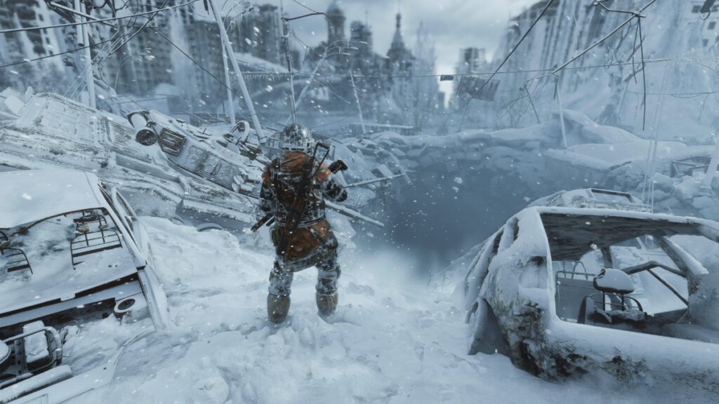 A character prepares to enter a frozen tunnel beneath a city in Metro Exodus