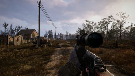 The player walks through a ruined town in the daylight with their rifle drawn