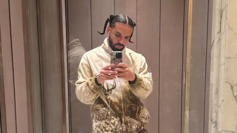 Drake posing in front of mirror.