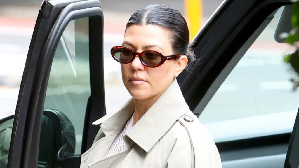 Kourtney Kardashian in a trench coat