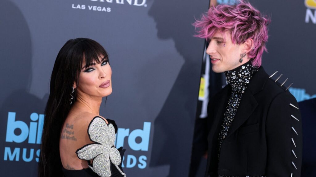 Megan Fox and Machine Gun Kelly at an event.