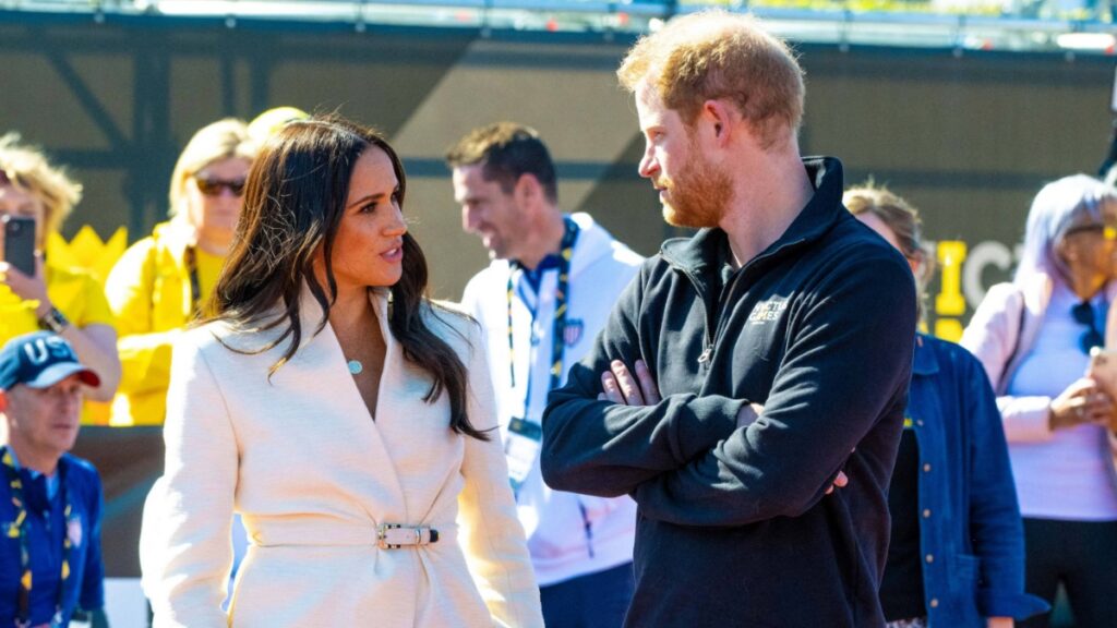 Prince Harry and Meghan Markle in conversation.