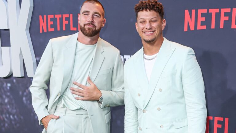 Travis Kelce and Patrick Mahomes posing on the red carpet.