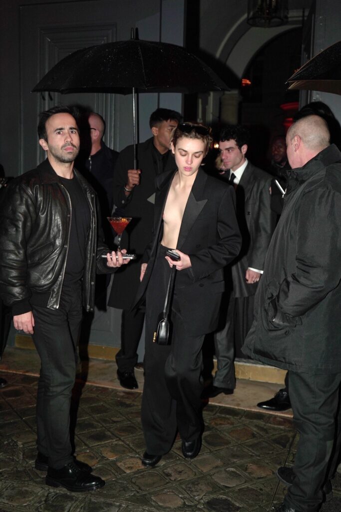 va Capri experiences a minor fashion slip as she exits a YSL after-party during Paris Fashion Week.