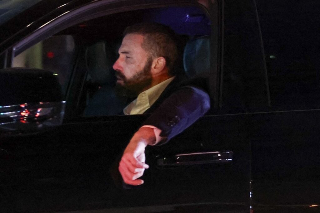 Los Angeles, CA  - *EXCLUSIVE*  - Actor Ben Affleck opens his eyes wide in shock while driving home from his office to see the huge wild fire burning across the street from where he lives in Los Angeles.
