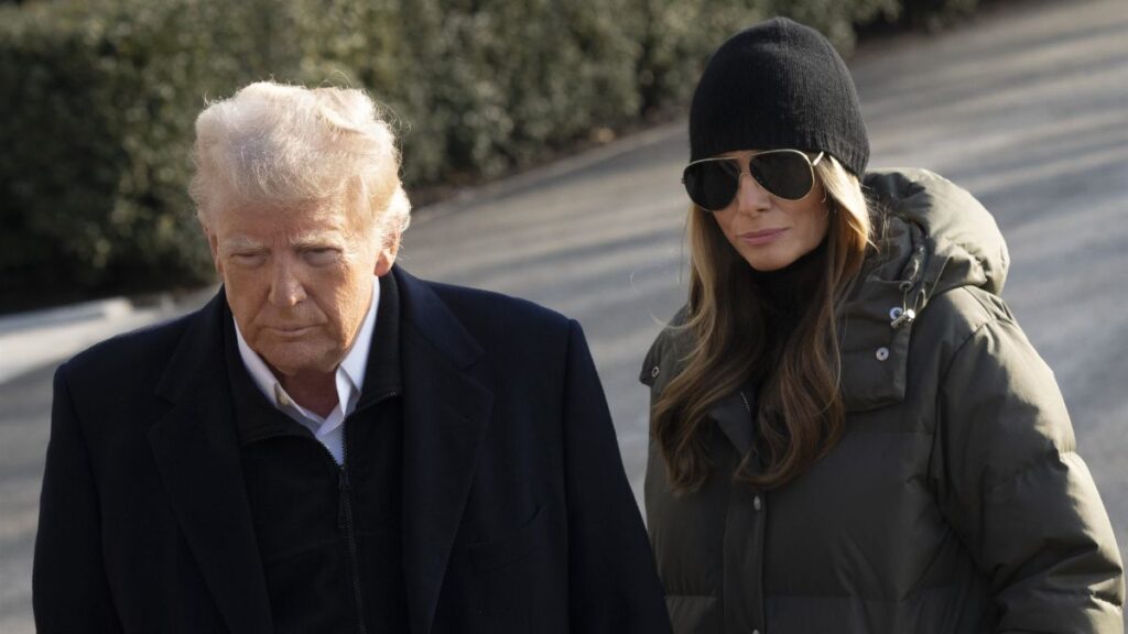 United States President Donald Trump addresses the media alongside First Lady Melania Trump before departing the White House