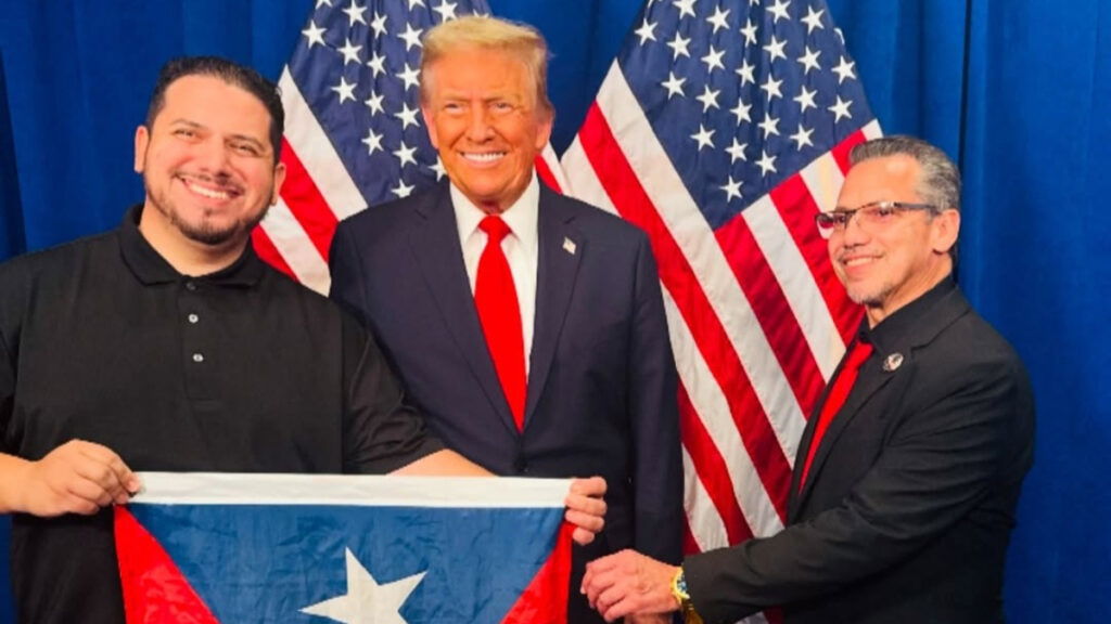 Donald Trump poses beside Latinos for Trump members