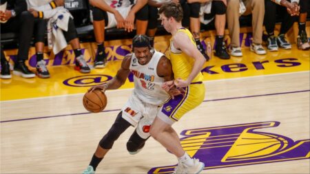 Jimmy Butler takes on Laker's guard Austin Reeves