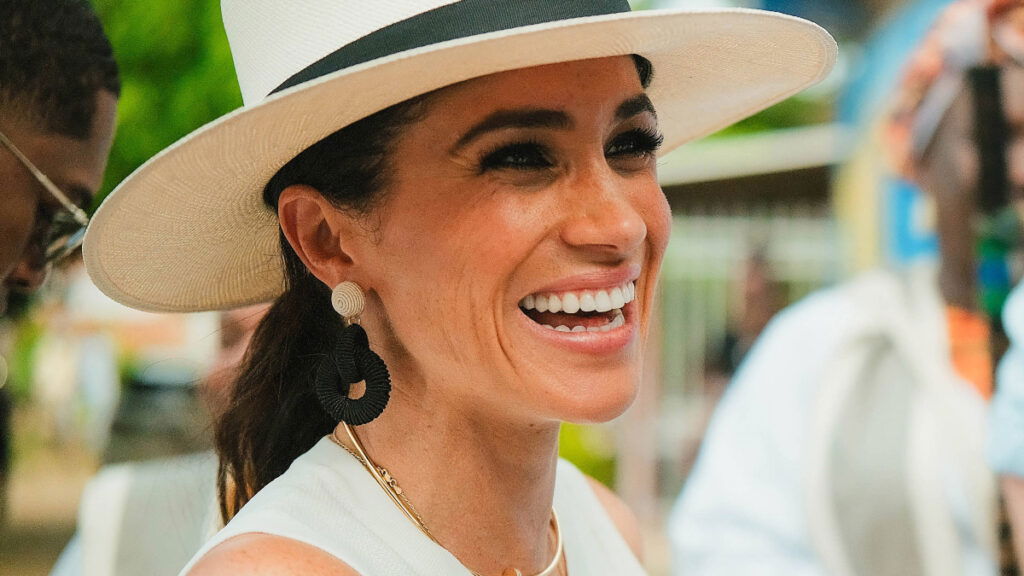 Meghan Markle wearing a white outfit during Colombia visit with Prince Harry.