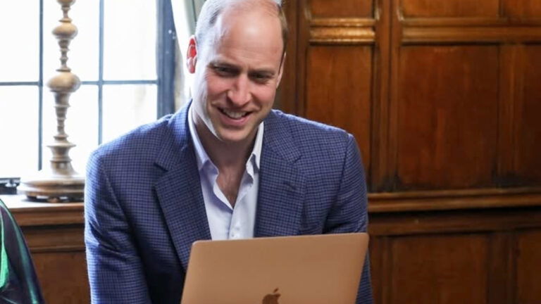 Prince William staring at a laptop during a meeting as part of his "We Can End Homelessness" project.