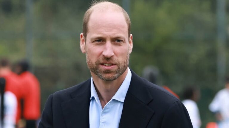 Prince William interact with athletes at a sports event.