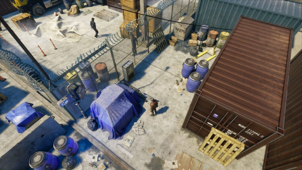 The player navigates around guards and a chainlink fence in Sniper at Work