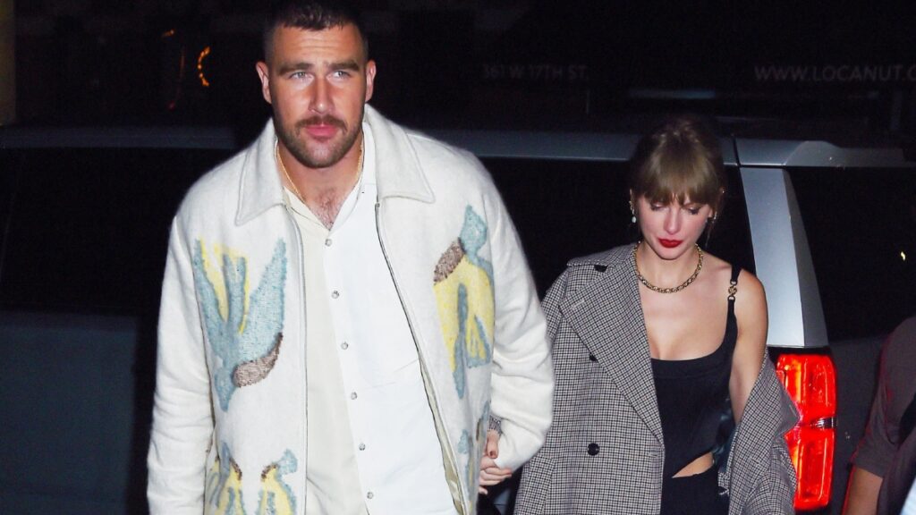 Taylor Swift and Travis Kelce hold hands as they arrive to the snl after party.