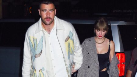 Taylor Swift and Travis Kelce hold hands as they arrive to the snl after party.