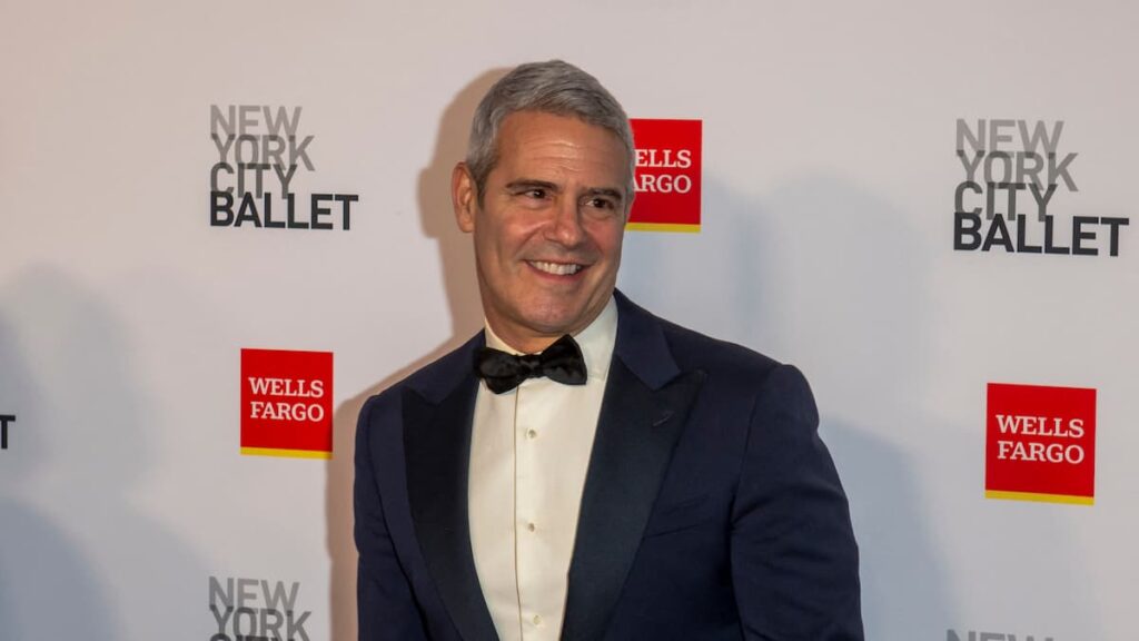 Andy Cohen posing on the red carpet.