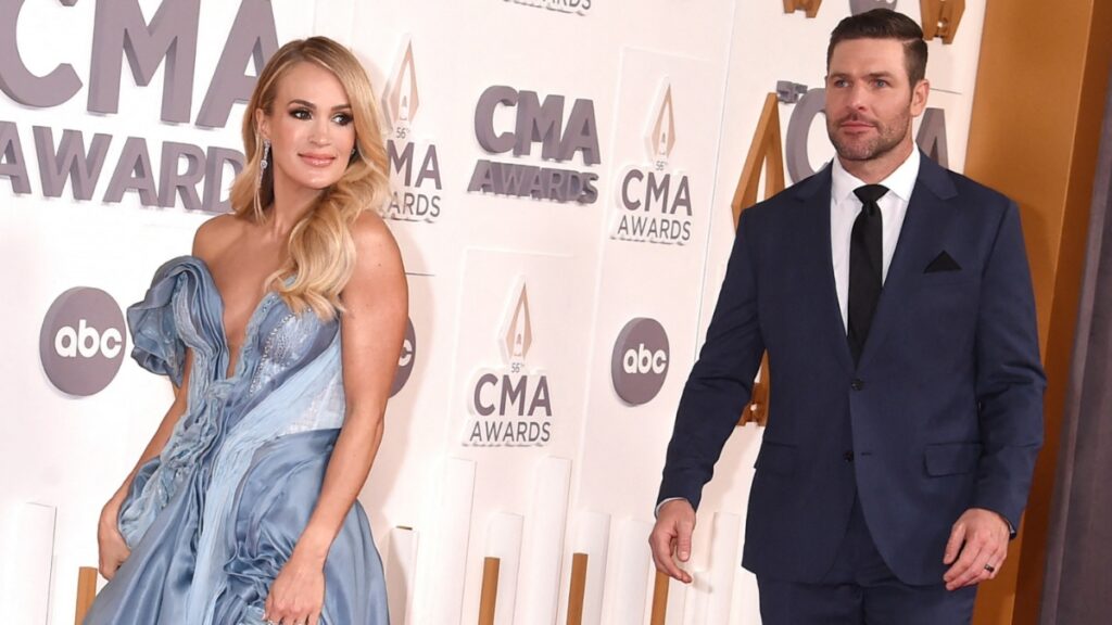 Carrie Underwood and husband Mike Fisher on the red carpet.