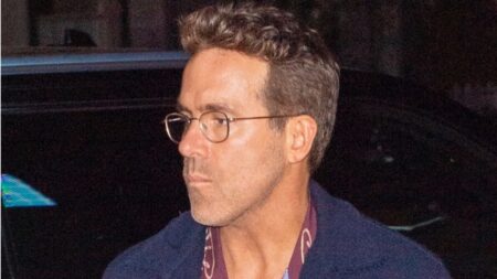 Ryan Reynolds wearing glasses.