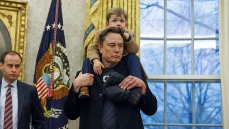 Elon Musk is seen with his son X, as he gives remarks to the media, in the Oval Office of the White House in Washington DC