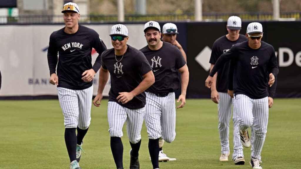 New York Yankees players warm up at the Yankees spring training complex.