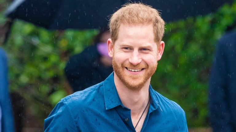 Prince Harry in a blue shirt.