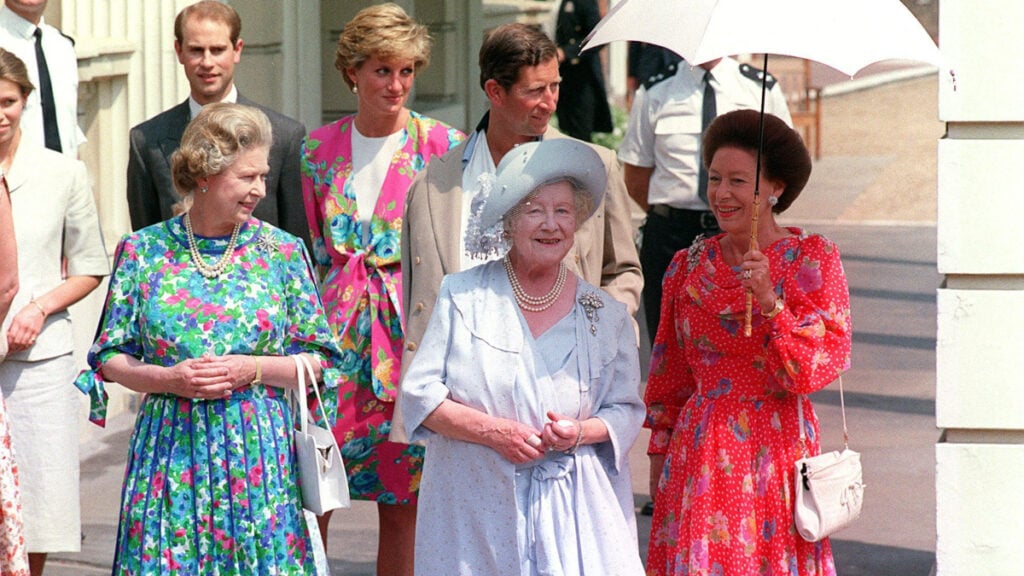 Princess Diana posing with King Charles and the royal family.