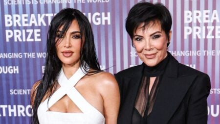 Kim Kardashian poses with mother Kris Jenner at event