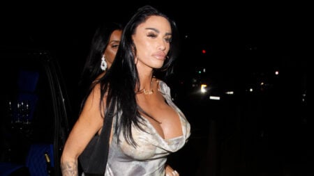 Katie Price attends the UK Glamour event in silver dress.