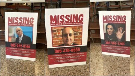 Prop missing persons posters depict the Miami Representatives dodging the empty town hall event