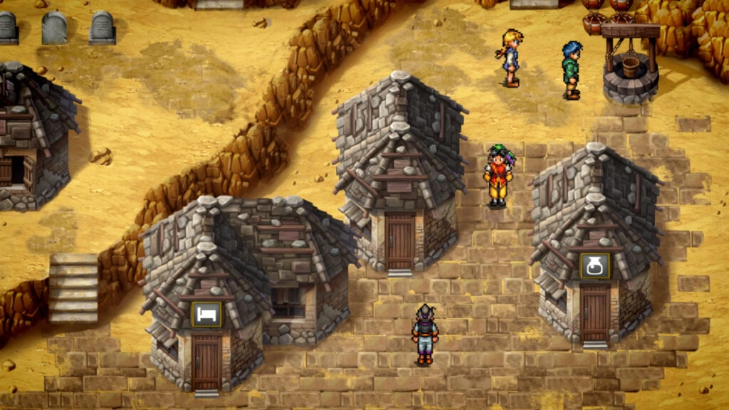 A rocky village with cobblestone streets and yellow sand surroundings in Suikoden 1 and 2 HD