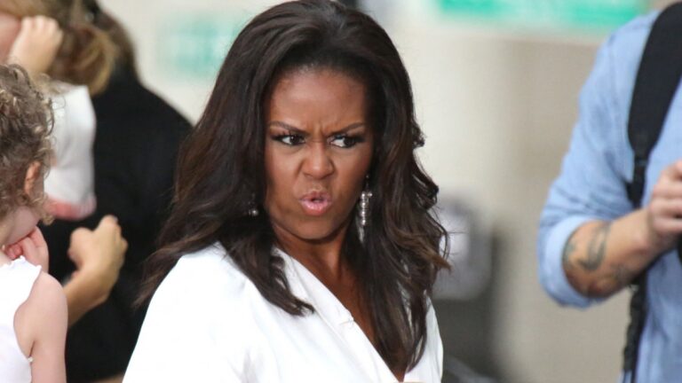 Michelle Obama in a white dress.