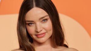 Miranda Kerr smiling as she poses for a photo at the Vanity Fair Oscar Party