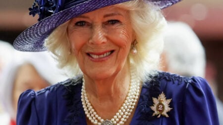 Queen Camilla wearing a purple outfit during visit to Canada.