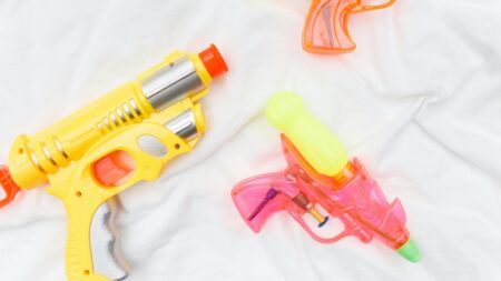 multiple water guns on blanket