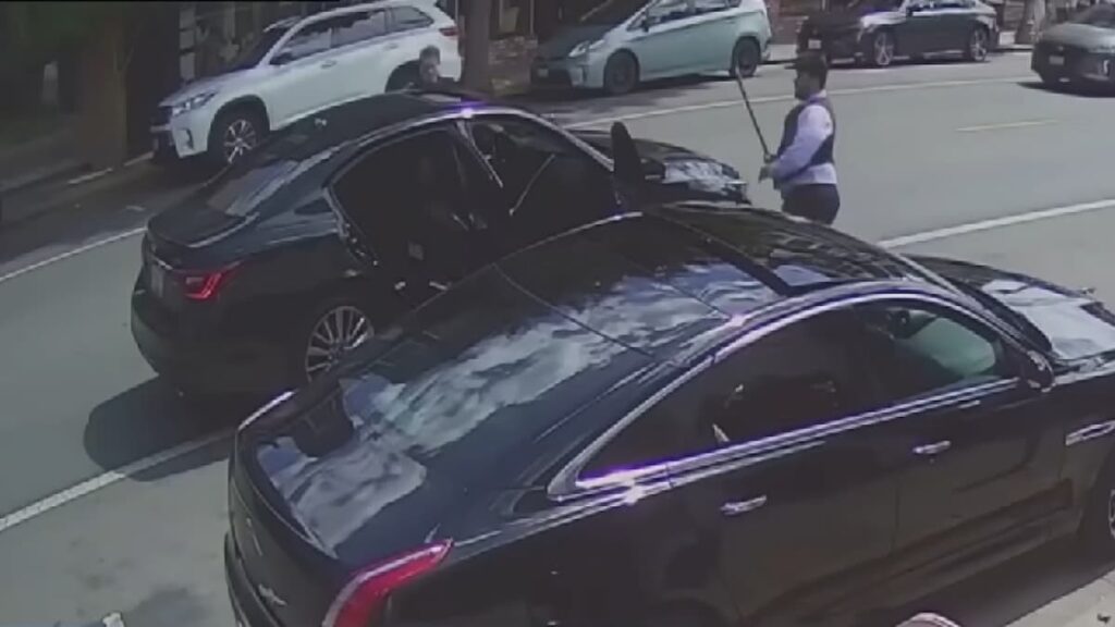 two bystanders attacking some carjackers' getaway vehicle