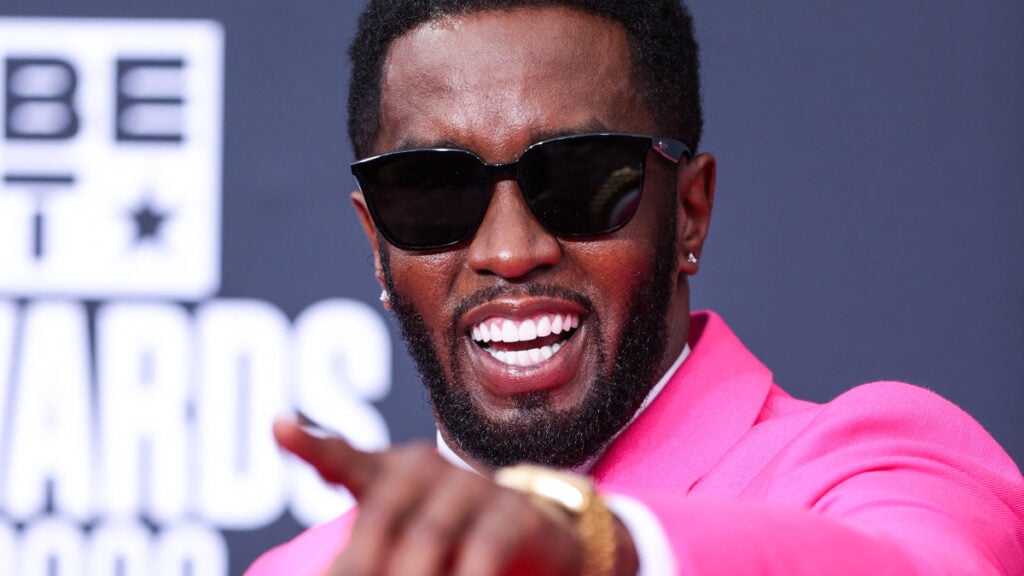 Diddy in a Pink outfit.
