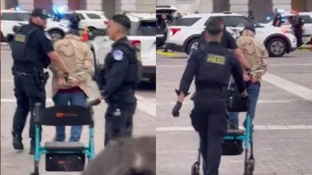 A picture of the Washington veteran being arrested.