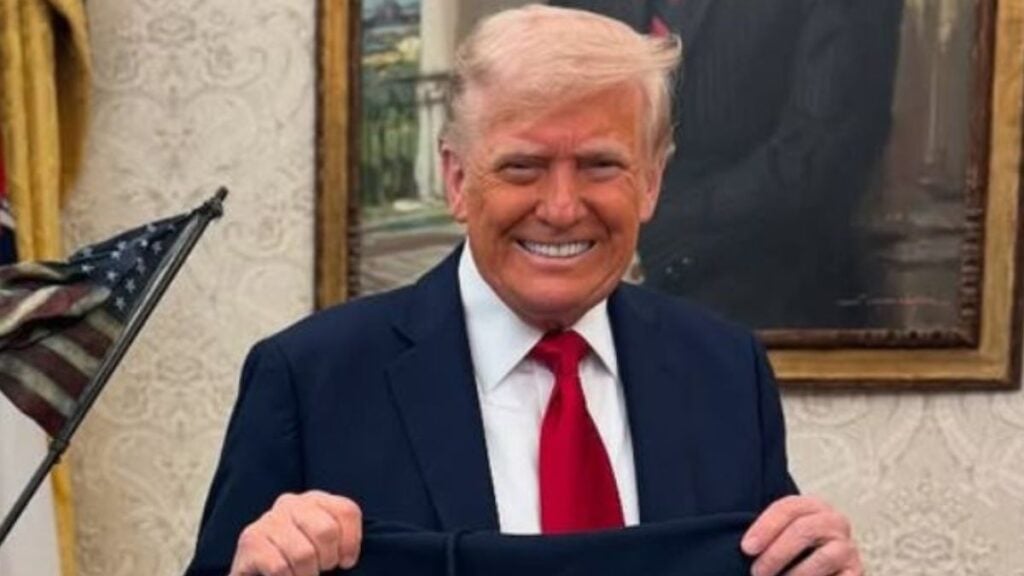 Donald Trump in Oval Office with sweatshirt
